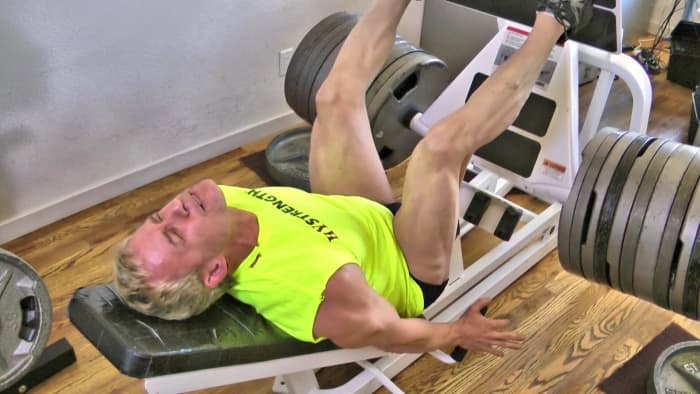 I am doing a leg press with 1100 lbs in this photo. I typically do just one set per workout.