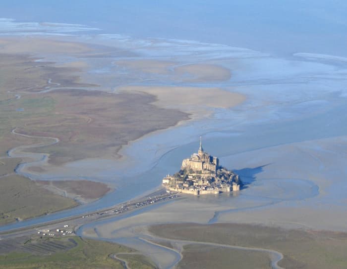 Mont St Michel aerial view at low tide, showing the dangerous quicksands and channels where Harold rescued one of William's men