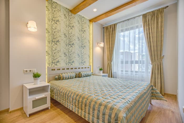 The bigger the curtain rod, the better. You can trick people into thinking a room is bigger by setting your curtains higher.