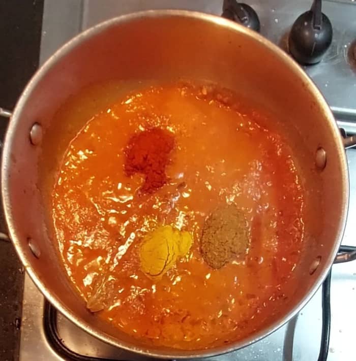 Add ground paste and 1/4 cup of water. Mix well. Add 1/2 teaspoon turmeric powder, 1/2 teaspoon red chili powder, 1/2 teaspoon garam masala powder and salt to taste.