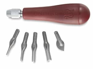 The tips of the linoleum carving tool can be removed and changed. There are several sizes of gouges as well as other attachments to help create the design in the linoleum block.