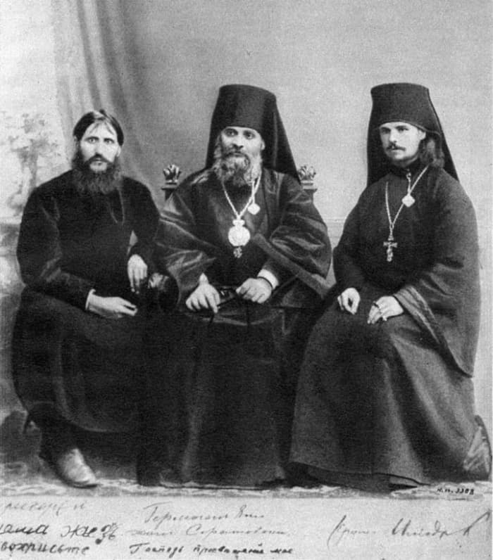 Rasputin, Hermogen and Iliodor next to each other in 1906. In 1912 Alexandra ordered Hermogen to be banished to a monastery after he beat Rasputin with a crucifix; Iliodor went into exile after the attack by Khioniya Guseva in June 1914