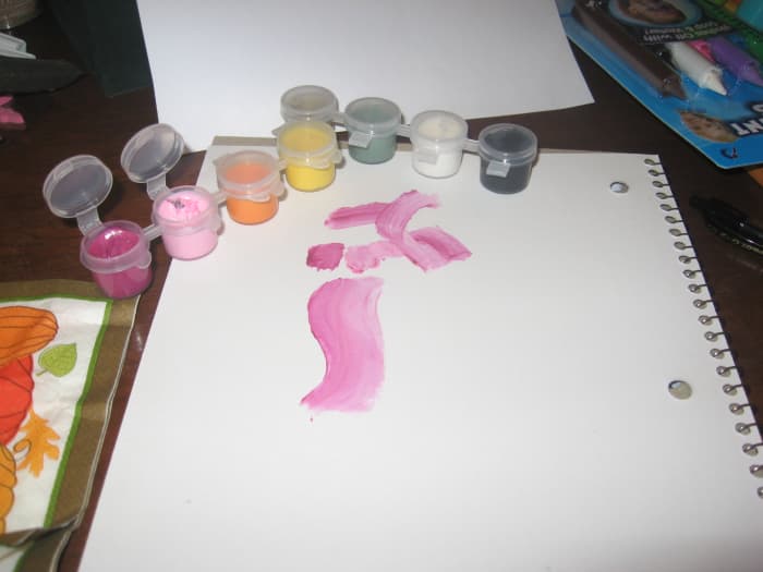 Loading the brush or sponge with more than one color will create depth and smooth transitions.