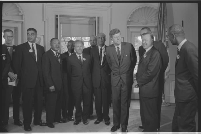 During the 1960s, Democrats became the party of civil rights and government activism. President John F. Kennedy is pictured here with civil rights leaders including Martin Luther King Jr. Both Kennedy and King were assassinated.