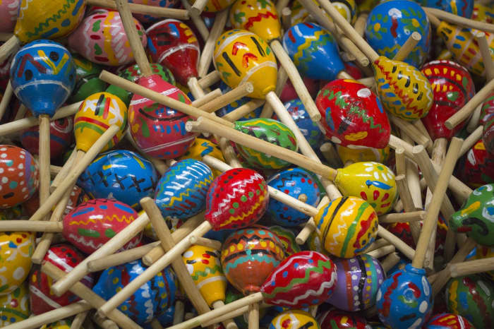 Maracas, egg shakers, rhythm sticks, and jingle bells are simple musical instruments that toddlers and preschoolers can use to play along with preschool music.