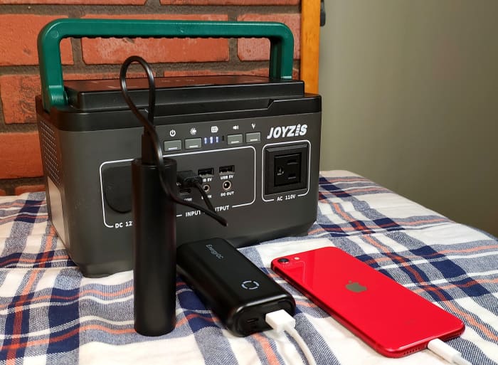 View of 5000mAh power bank being charged at the power station. The 10000mAh power bank is charging my iPhone