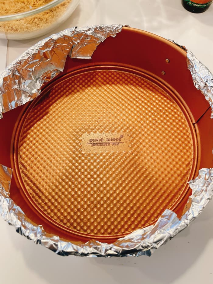 Grease an 8-inch round baking pan with baking spray. Line the bottom pan with heavy-duty aluminum foil, allowing two of the sides to overlap.