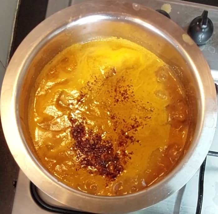 Transfer the cooked radish and chana to a vessel along with cooking water. Add the ground paste and mix well. Add salt to taste. Cook well for 3 minutes or until raw smell of masala vanishes. Add 1 1/2 teaspoon jaggery and mix.