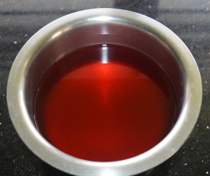 Squeeze the peels to get kokum syrup. Once again, add hot water and squeeze the peels to get more syrup. Strain to remove the impurities.