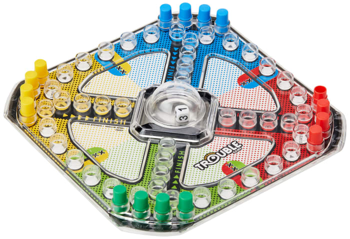 The Trouble game board features a "Pop-o-matic" bubble encasing a single die, and 16 game pegs in 4 colors.