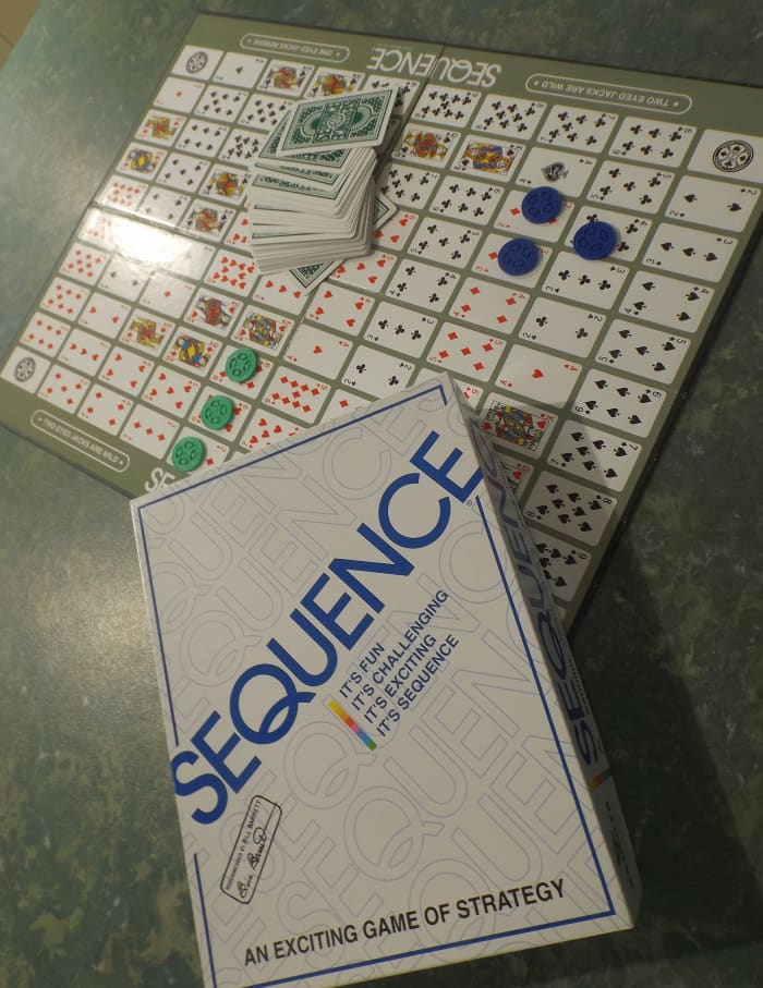 The object of Sequence is to get 5 tokens in a row, either horizontally, vertically, or diagonally. You may only place your tokens on the spaces that match the cards in your hand.
