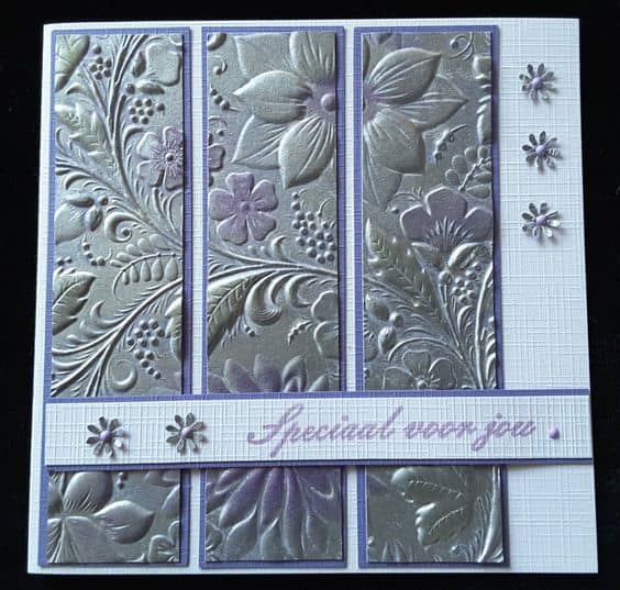 Emboss a aluminum foil for a greeting card. Then cut it into three pieces to create a paneled greeting card