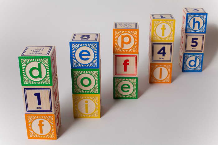 Brightly-colored alphabet blocks for toddlers are easy to stack and add to a reading-ready play environment. Make sure building blocks are made with non-toxic paint.