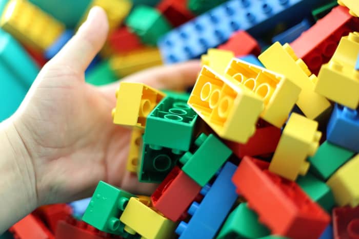 Lego Duplo blocks are larger than standard legos. They are a better option for toddlers and younger preschoolers.