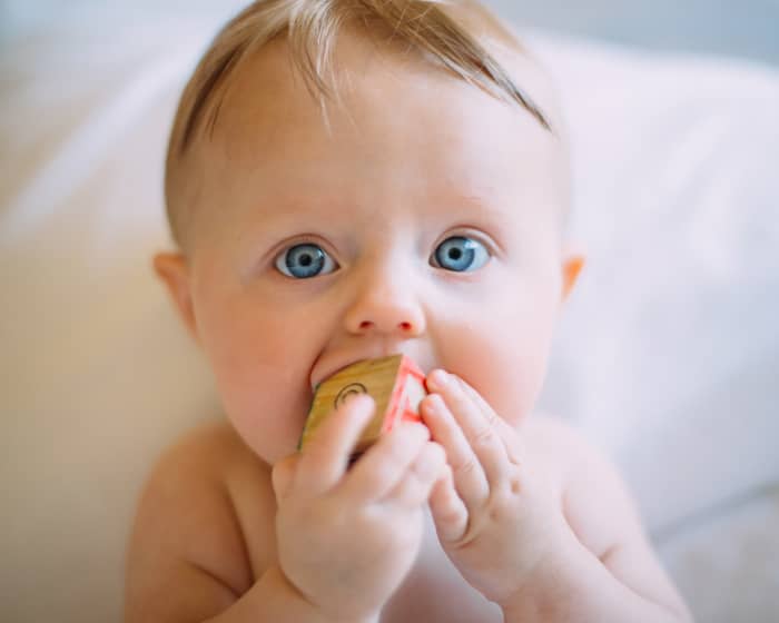 Alphabet blocks have a consistent, small size that is easy for toddlers to manipulate. Look for non-toxic paints and toys that are not choking hazards.
