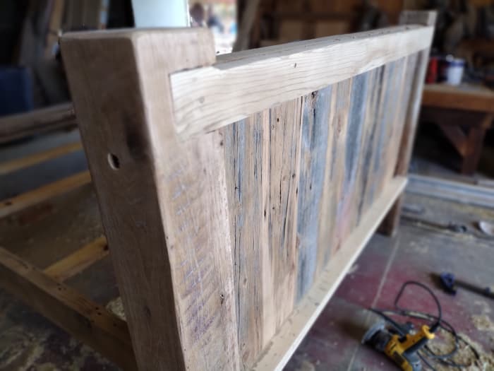 A beautiful, handcrafted queen headboard in progress and available at The Cripple Creek Wood Shop.
