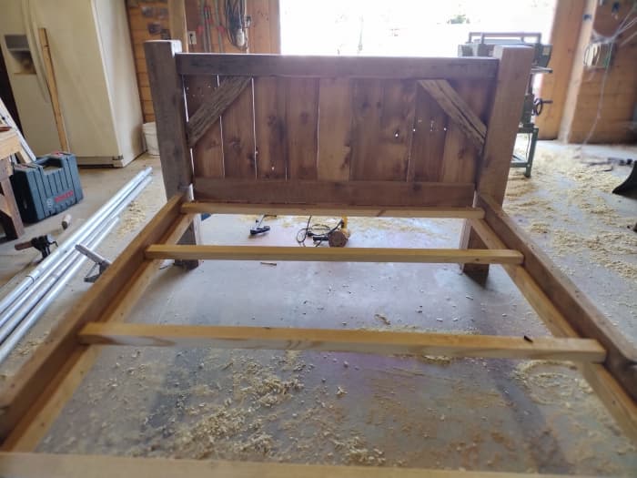 A handcrafted queen size bed in progress at the Cripple Creek Wood Shop in Newport, New Jersey.