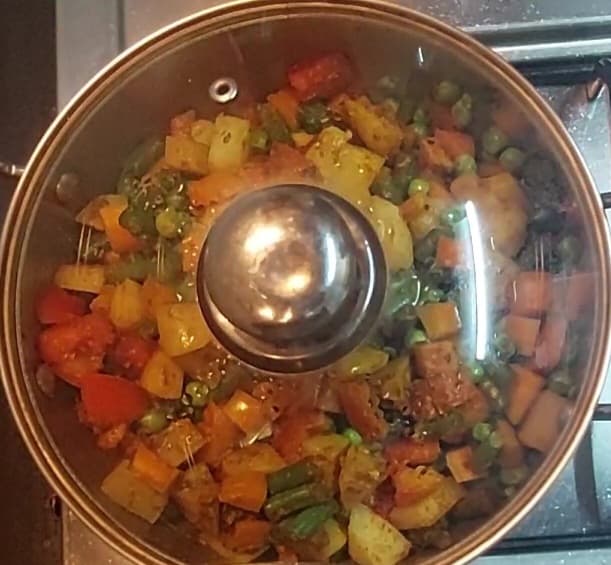 Add 1/4 cup of water if required, close the lid and cook for 5 minutes or till vegetables are cooked well.