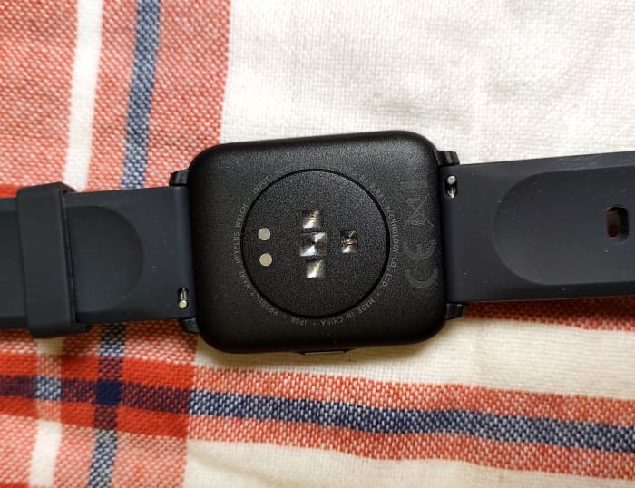 View of the Three-axis accelerometer, heart rate sensor, and blood oxygen sensor pads. Also located here are the two charging pads