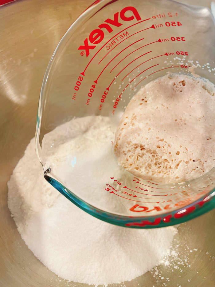 In a stand mixer bowl fitted with a dough hook, combine the bread flour, all-purpose flour, sugar, and yeast mixture.