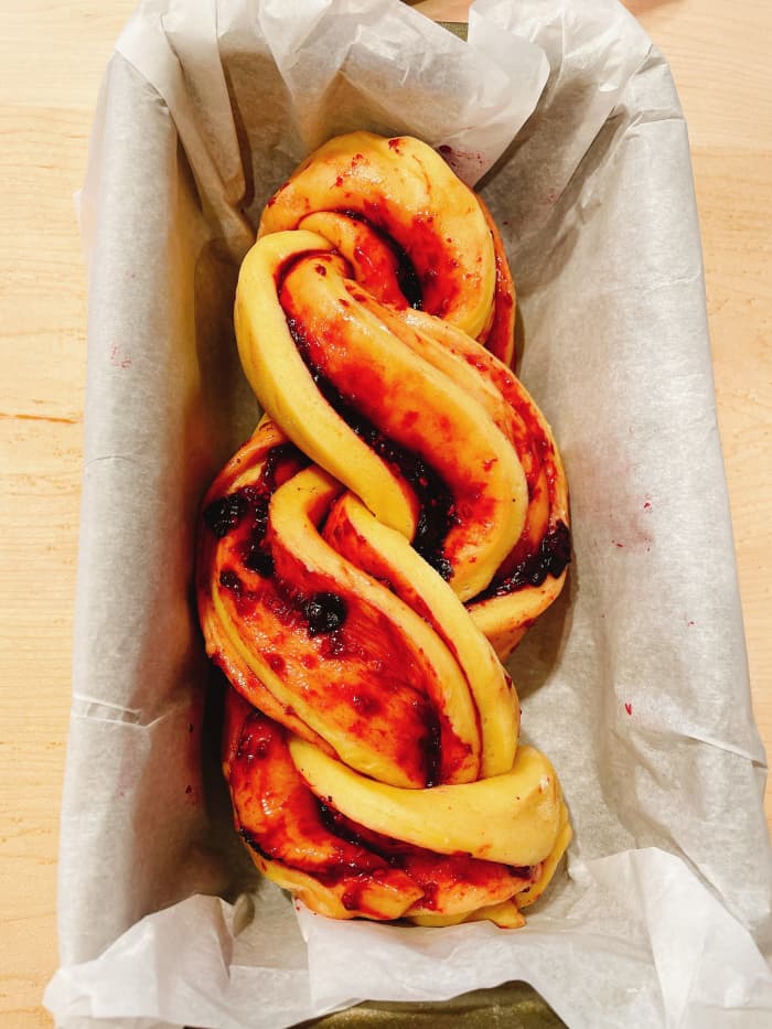 Transfer the babka to the prepared pan. Cover with a cling wrap and let it sit at a warm place to rise.