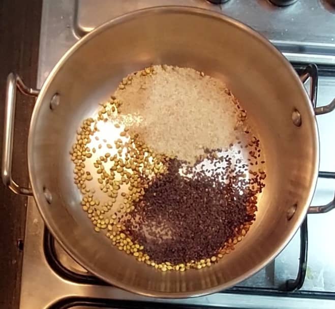 In the same pan, add 1 tablespoon coriander seeds, 1/4 teaspoon methi seeds, 1 tablespoon black sesame seeds and 1 tablespoon poppy seeds.
