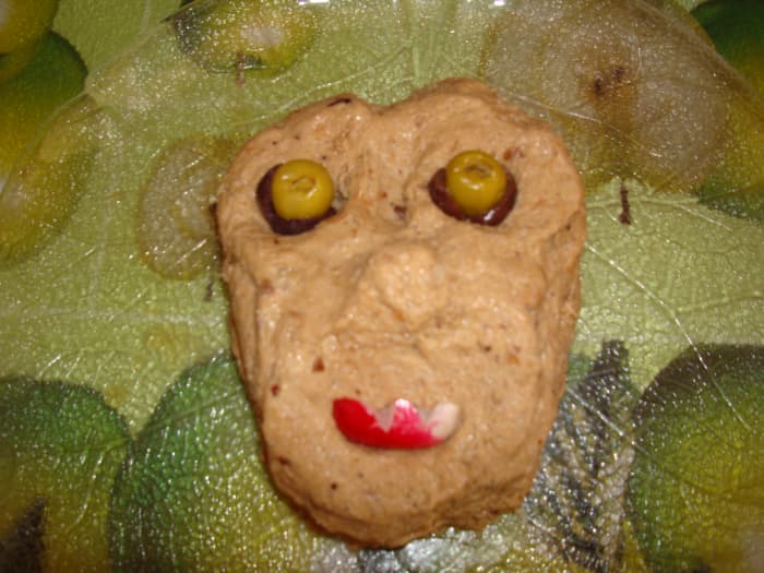 Rillettes are a preparation of meat similar to pâté normally used as spread on bread or toast and served at room temperature.