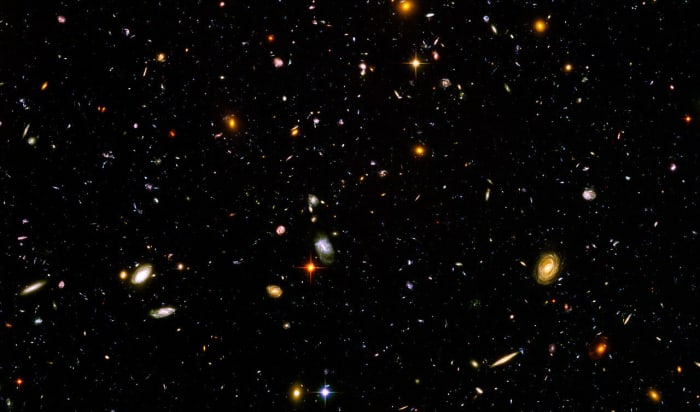 A Hubble Space Telescope image containing thousands of galaxies of various ages, sizes, shapes, and colors