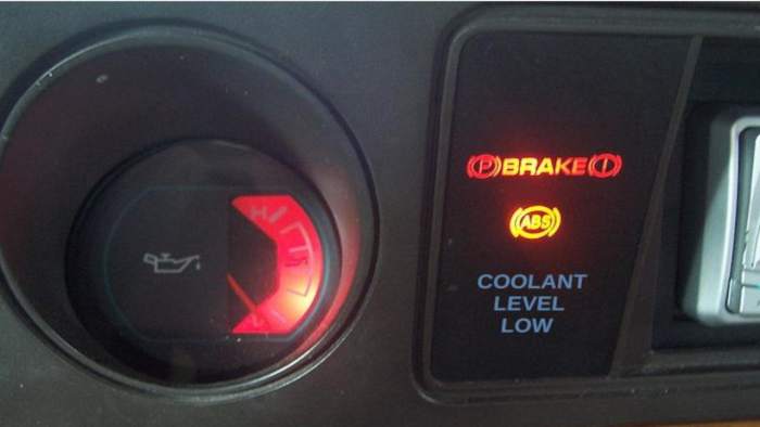 Why Is My Low Coolant Level Light On? - AxleAddict