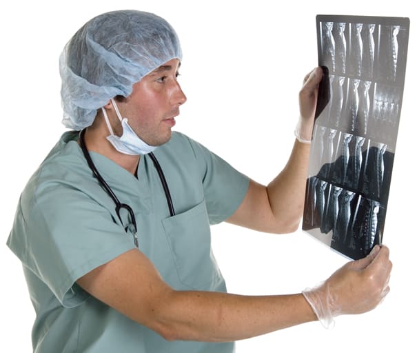 This guy isn't actually looking at an x-ray of a heart, I just needed a stock photo of someone in the medical profession.