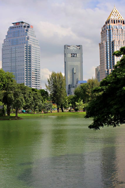The Lumpini Lake, with skyscrapers beyond. In the park you only have to look to the horizon to see that the bustling city of Bangkok is never very far away