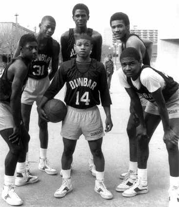1984 Dunbar Poets (from left to right) Darryl Wood, Reggie Lewis, Reggie Williams, Tim Dawson, Jerry White. (Center) Muggsy Bouges