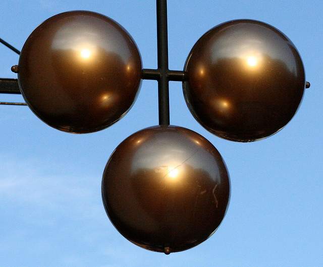 The three balls are the ages-old traditional symbol for a pawn shop; it stems from the days when a great many people could not read