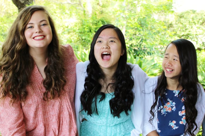 Our three youngest children at a recent photo shoot. You can tell we are having fun!