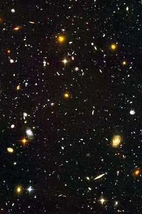 A miscellany of stars and galaxies - sadly, you won't see this with the naked eye or binoculars! Some of the stars are just a few light years distant. But the galaxies are many millions of light years distant