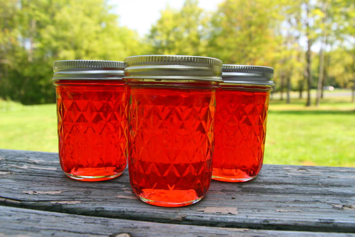 Candy Apple Jelly is beautiful and tastes like baked cinnamon apples. This is an excellent homemade gift during the holiday season!