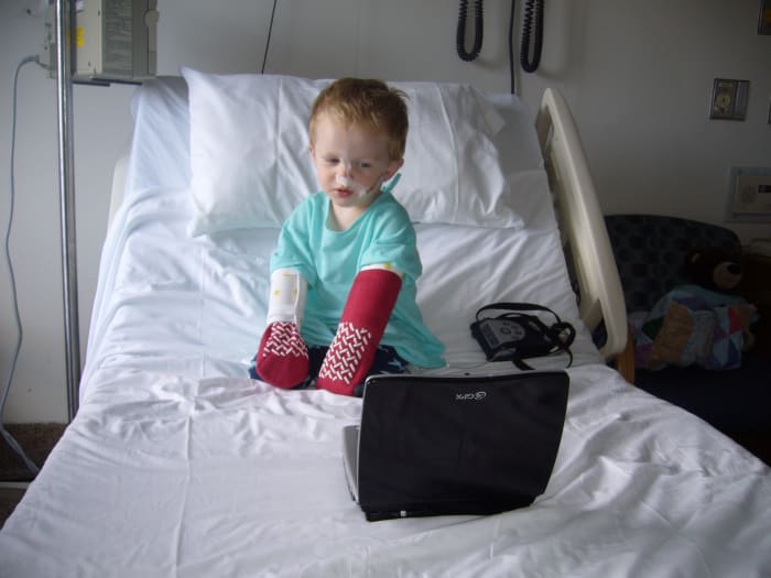 Arm bands called "no-no's" and socks were used to prevent our son from pulling out the probe. A portable DVD player kept him entertained during the hospital stay.