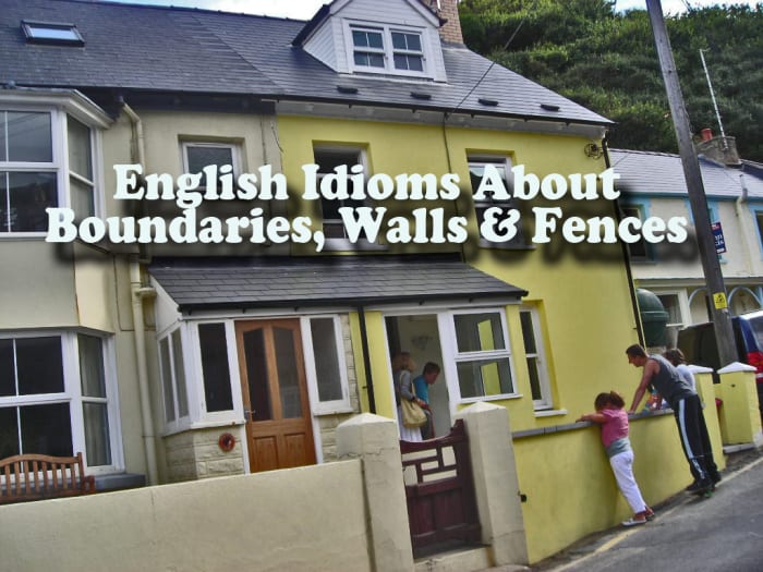The front walls of these Welsh cottages form the boundary between public land (the pavement) and private land (the cottage and garden)