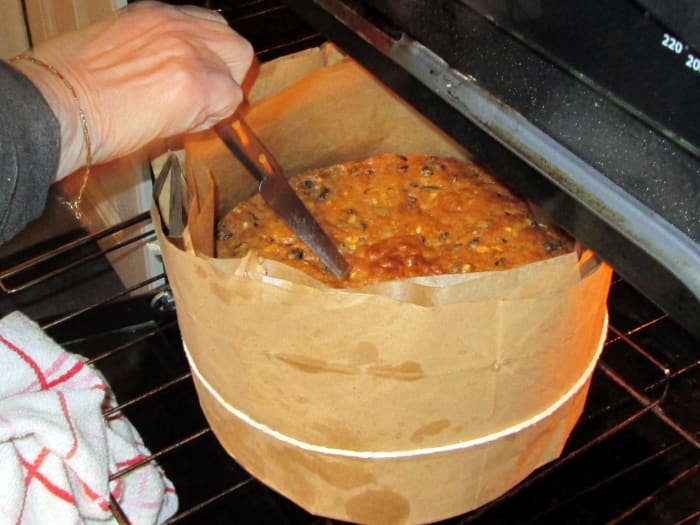 Use a clean knife to pierce the centre of the cake. If it comes out clean and dry then the cake is cooked.