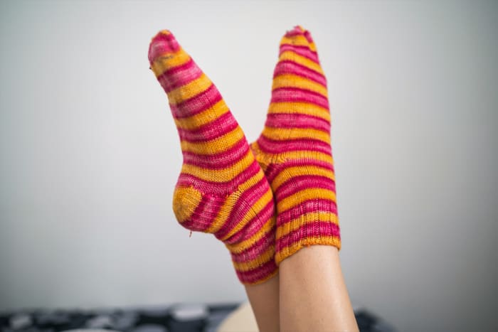 Keep your feet warm with cozy socks to reduce the chance of chilblain development, especially in winter.