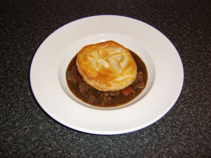 This beef steak and kidney stew with HP Sauce and a monogrammed puff pastry disc is just one of the beef stew recipes to be found on this page
