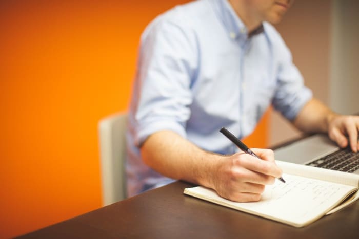 Jotting down notes while writing an employee performance review will help ensure you don't miss a thing.