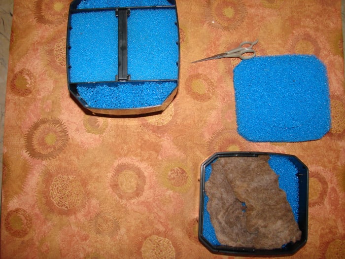 Mixing the old filter media with the new. I cut out a portion of the old sponge and placed it with the new.