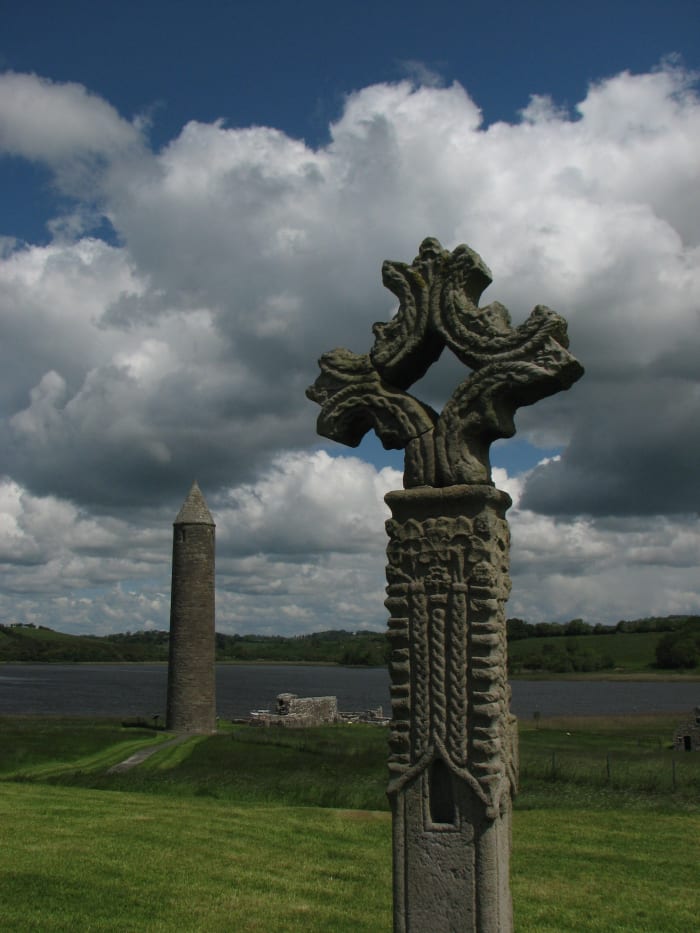 The abbey at Devenish island, Ireland, had a typical round tower (seen in the distance). Monaks would have climbed up to the top room in the tower by ladder and then pulled up the ladder leaving them and their valuables high above the ground.