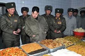 Kim Jong Un inspects food prepared for the military. In North Korea those who in power and those who protect them eat well.