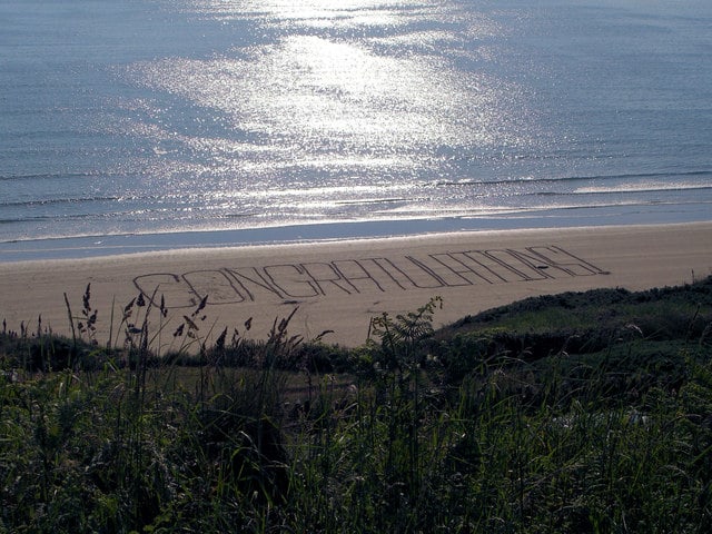 Congratulations written in the sand at the beach: I love it!