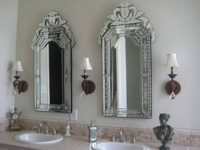 Replace a boring plate-glass mirror with something beautiful, fun or exciting. I love Venetian glass mirrors, as they provide plenty of lovely sparkle and elegance, much like a crystal chanedlier does.