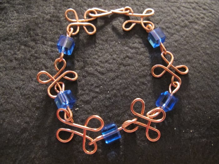 I like to use a dark background for my jewelry at fairs. It looks glamorous and helps the colors pop.