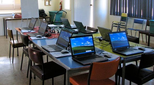 A training course for elderly members of a rural community to learn how to use computers and the internet.