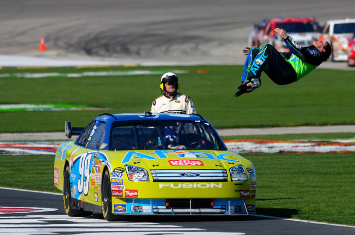 NASCAR driver Carl Edwards doing his celebratory back flip after winning a race in Texas.